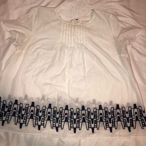 White top with blue detail